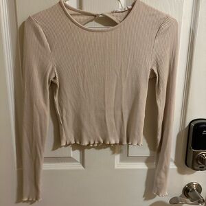 Light pink long sleeve crop top with open back